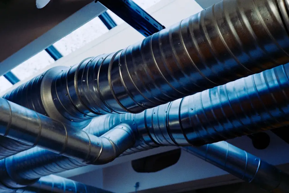 Stock photo: spiral metal ductwork in a commercial ceiling